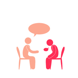 To personer som sitter på hver sin stol og snakker.